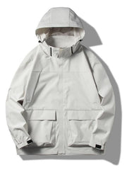 Hooded windproof jacket in Fog Lotus White with two chest pockets and two large front pockets.