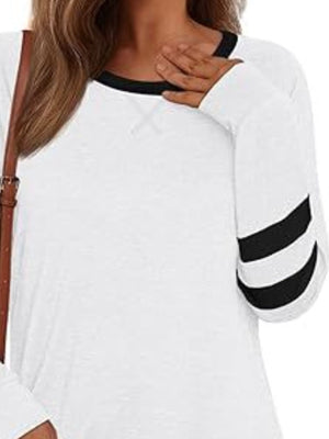 White t-shirt with black striped sleeves and a black neckline.