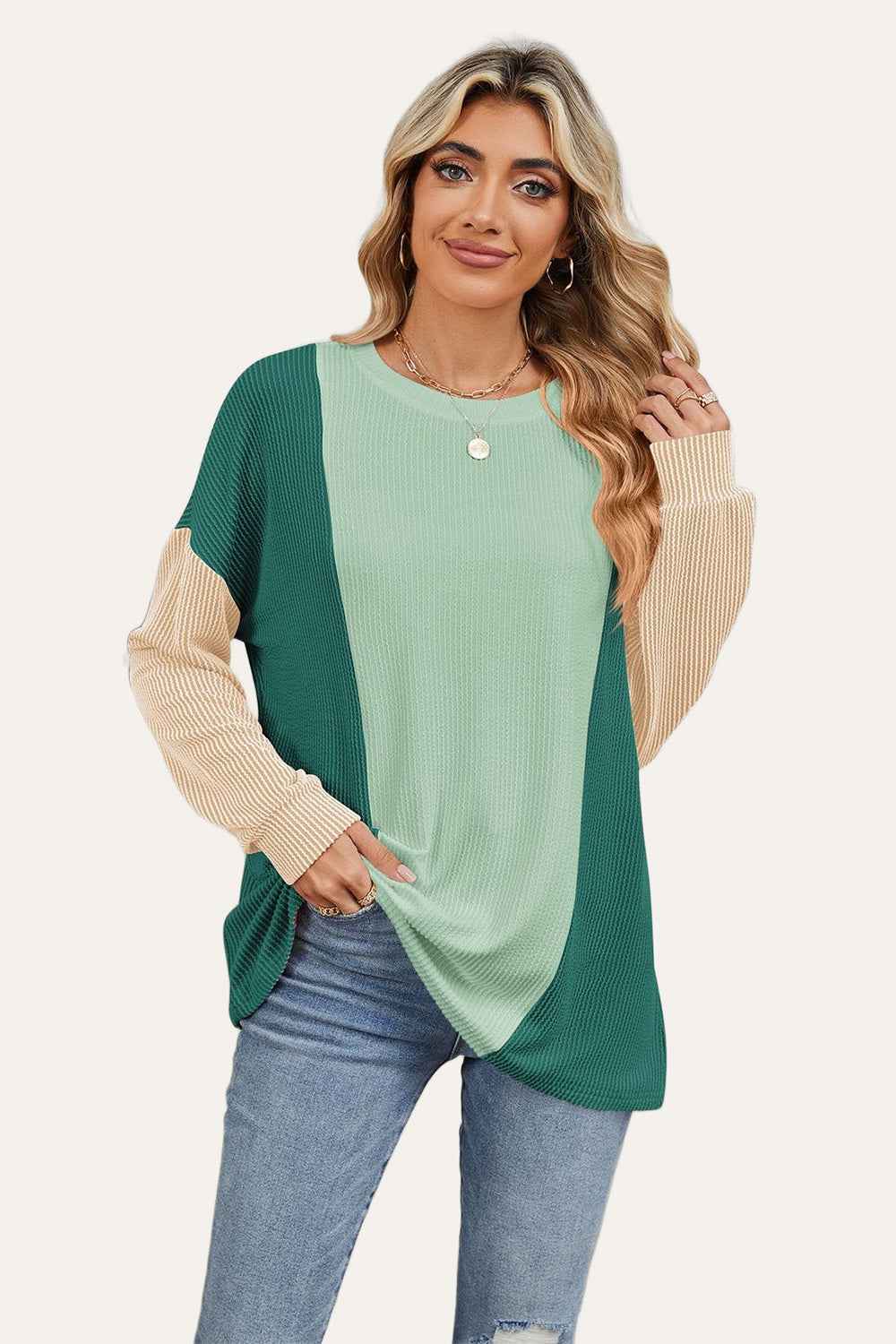 Colorblock waffle knit pullover sweater with crew neck and long sleeves in green and tan.