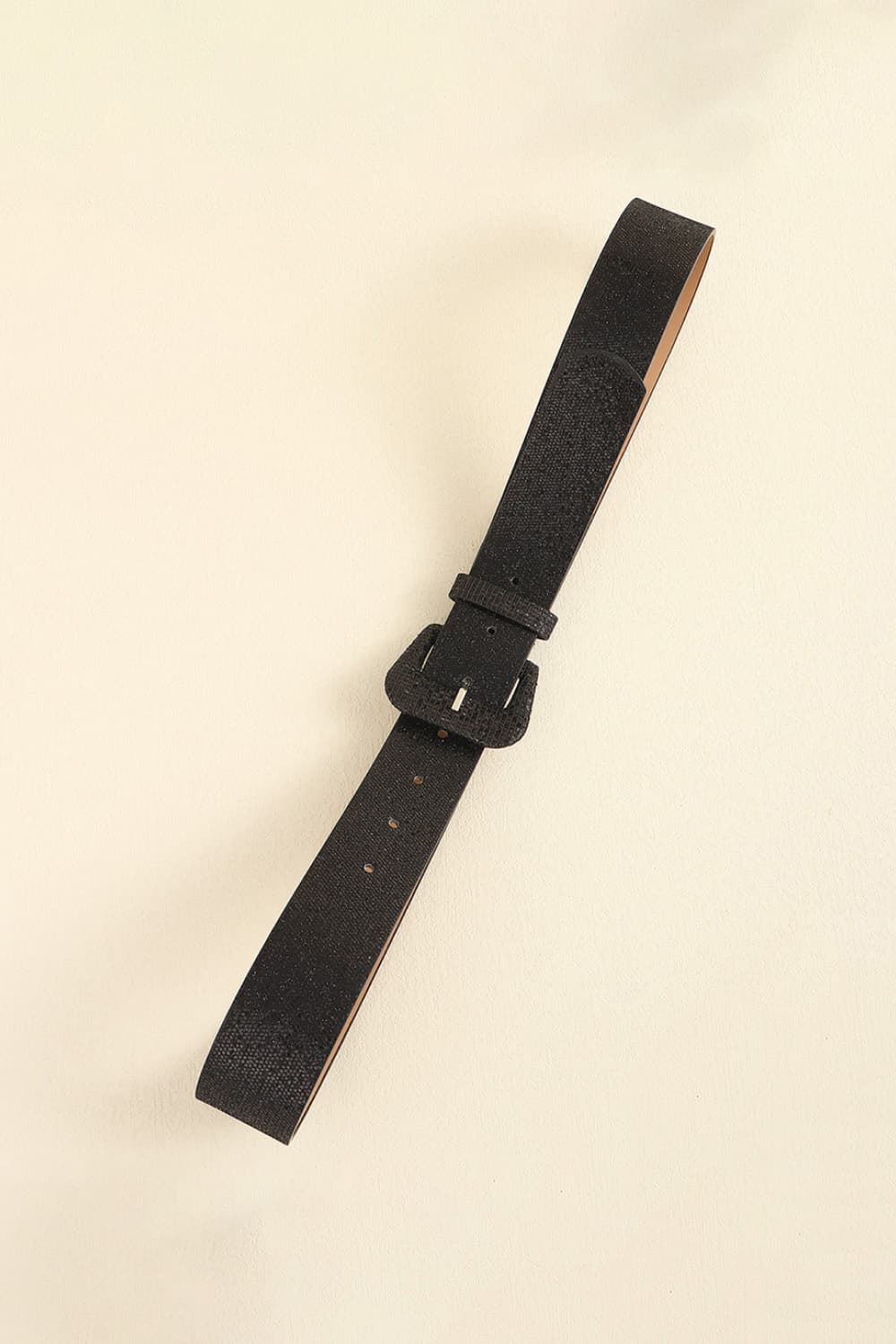 Black glitter belt with a square buckle and textured finish.