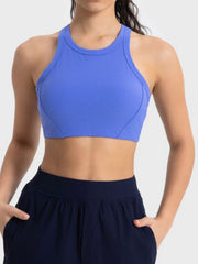 Ribbed blue racerback crop top with contour stitching and high neckline.