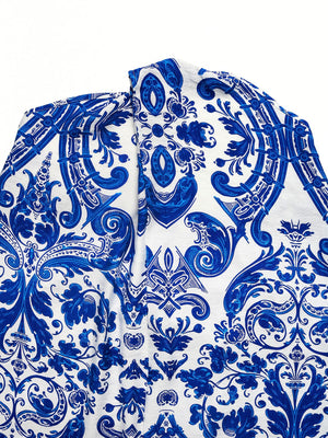 Blue and white patterned maxi dress with crisscross halter neckline detail