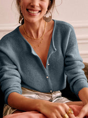 Dusty Blue cashmere buttoned cardigan with plunging neckline and ribbed texture.