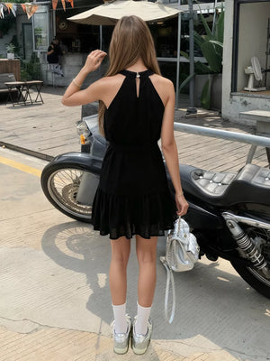 Black halter neck mini dress with tied waist and ruffled hem