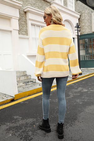 Oversized yellow and cream striped knit sweater with balloon sleeves.
