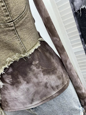 Edgy asymmetrical denim t-shirt with tie-dye print and frayed hem detail.