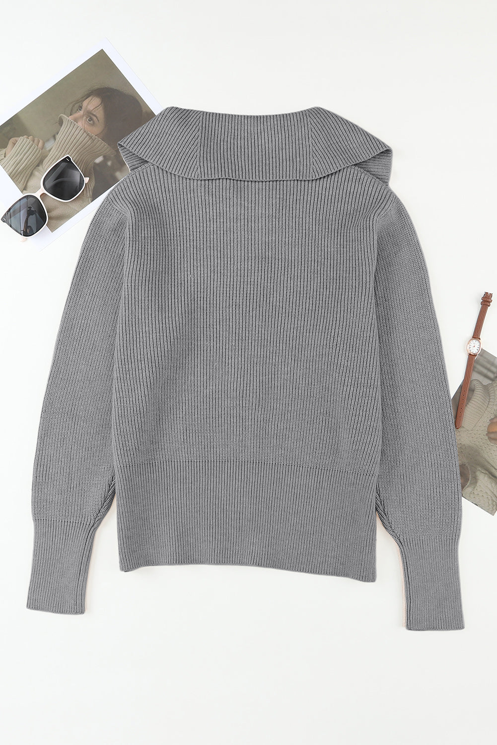 Gray ribbed knit cardigan with a shawl collar and cuffed sleeves.