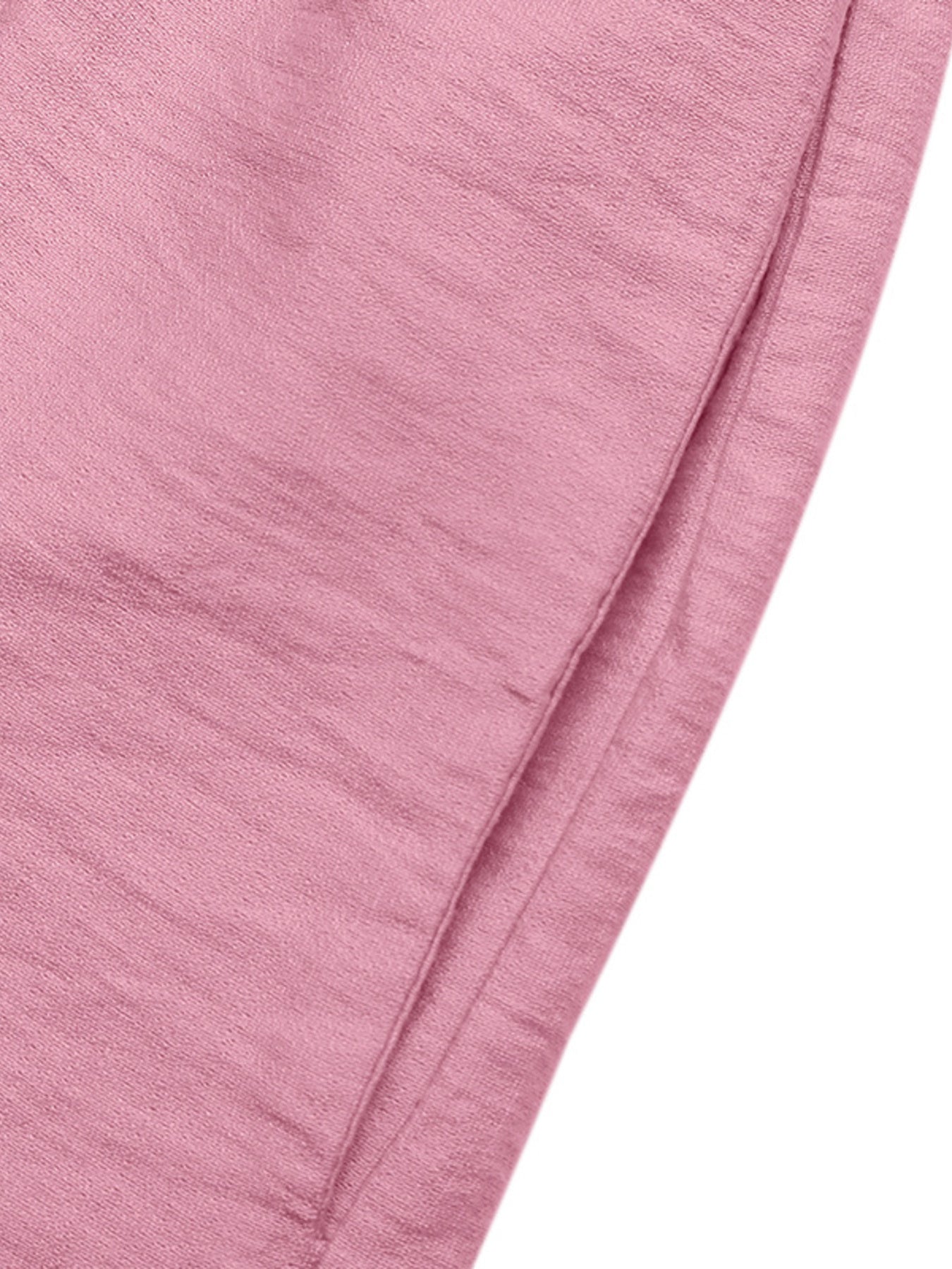 Pink maternity wrap romper with a textured fabric detail.