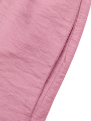 Pink maternity wrap romper with a textured fabric detail.