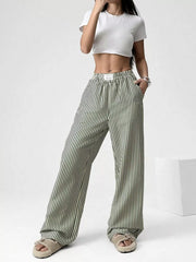 Navy striped high-waisted wide-leg pants with drawstring detail.