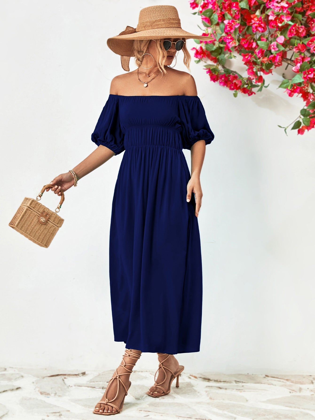 Dark blue off-shoulder midi dress with gathered bodice and balloon sleeves.