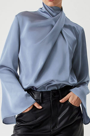 Dusty blue satin blouse with draped neckline and bell sleeves.