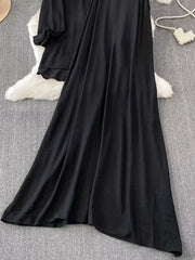 Black embroidered floral two-piece set with collared top and flowing skirt