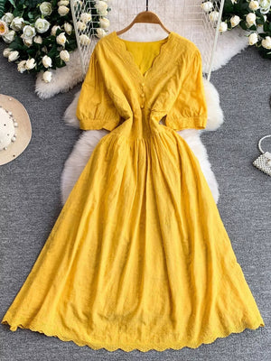 Yellow lace-embellished A-line midi dress with V-neck and button detail