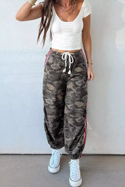 Camo print relaxed fit maternity pants with drawstring and red stripe detail.