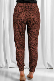 Brown leopard print jogger trousers with elastic waistband and cuffed ankles.