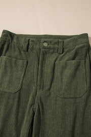 Moss corduroy flared leg trousers with front patch pockets and button closure.
