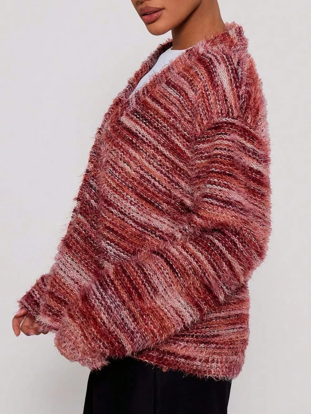 Cozy textured knit cardigan in rust with diagonal stripes and fuzzy details.