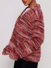 Cozy textured knit cardigan in rust with diagonal stripes and fuzzy details.