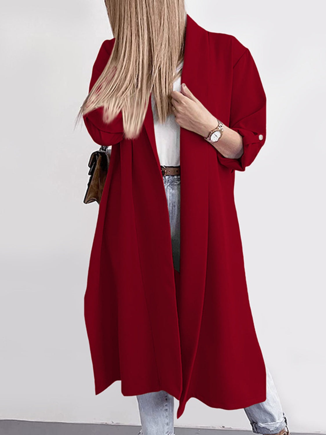 Deep red draped-front maxi coat with button cuffs and a relaxed fit.
