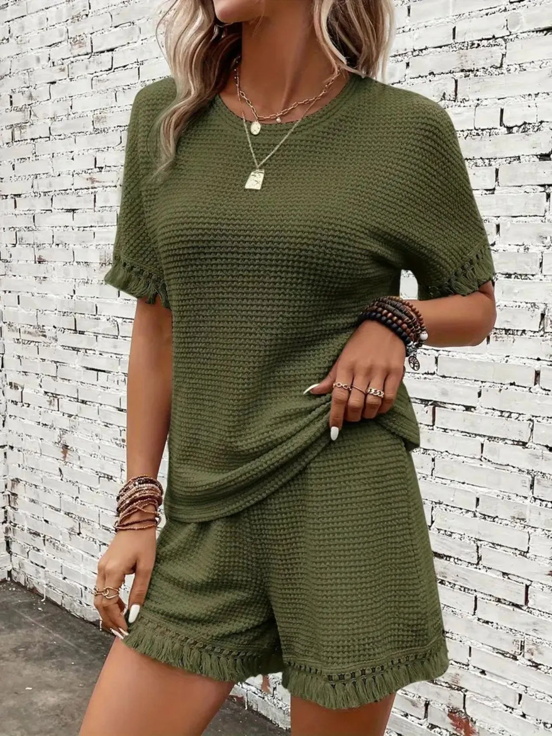 Moss textured knit set with fringe detail on short sleeves and shorts.