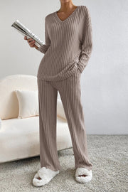 Cozy ribbed knit loungewear set in tan with V-neck sweater and wide-leg pants.