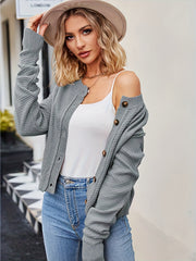 Gray acrylic button cardigan with textured knit and brown buttons