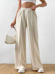 Cream V-waistline palazzo sweatpants with center seams and wide legs.
