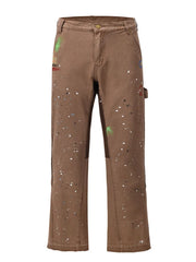 Taupe carpenter trousers with multicolor paint splatters and artistic details.