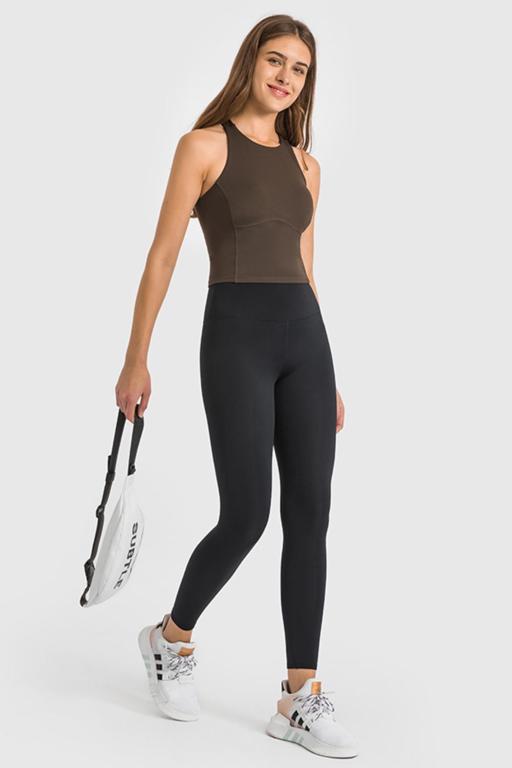 Black high-waist performance leggings with ankle length and a sculpted fit.