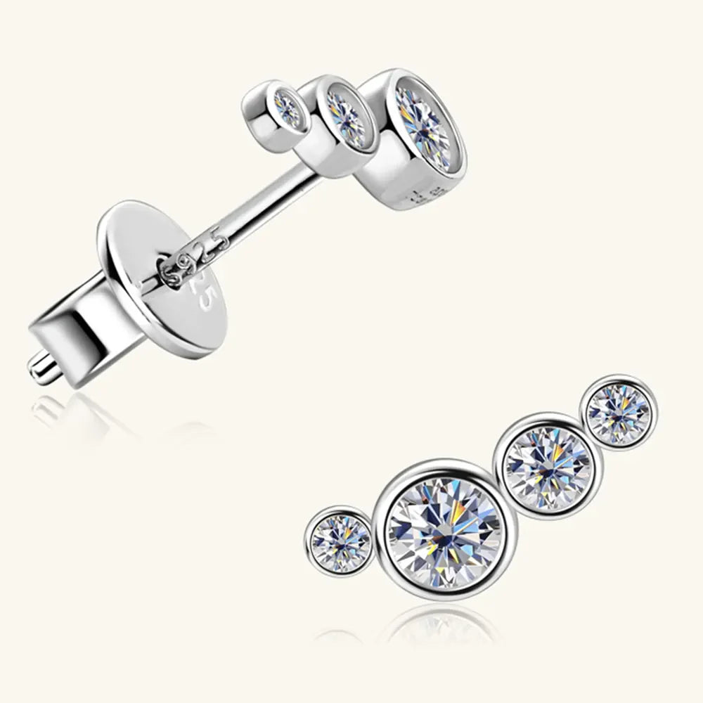 Silver ear climbers with four sparkling round cubic zirconia stones in a graduated cluster design.