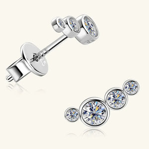 Silver ear climbers with four sparkling round cubic zirconia stones in a graduated cluster design.