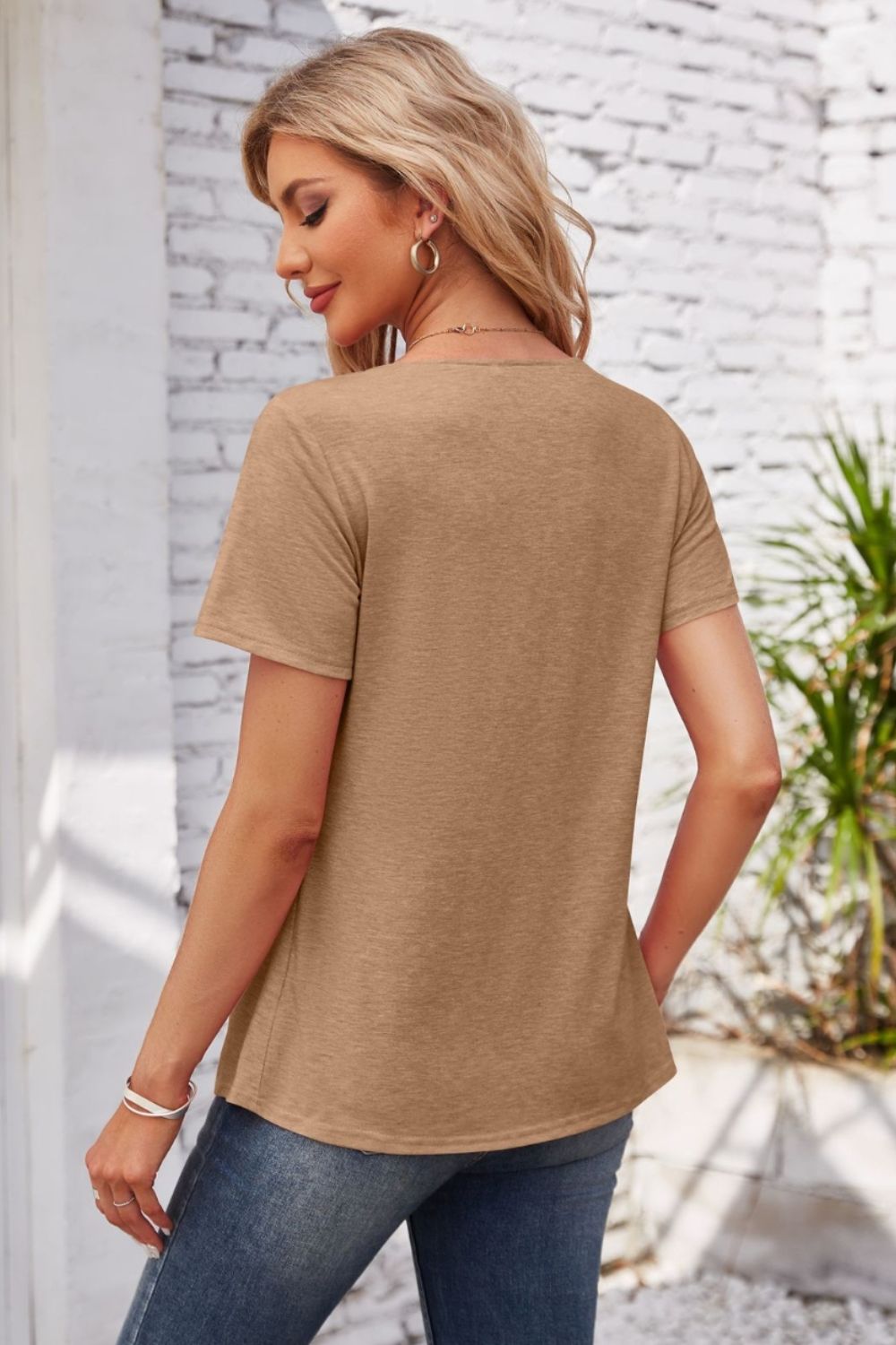 Button-trimmed gathered yoke top in mocha, a casual short-sleeve blouse.