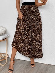Leopard print maxi skirt with knife pleats and a black waistband.