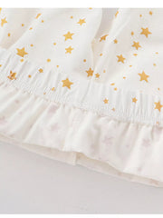 Baby girls' pajama shorts in blush pink with gold stars and ruffled hem