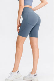 Light blue sculpting pocketed cycling shorts with a high waist.