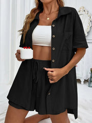 Black linen shirt and shorts set with drawstring shorts and button-up shirt.