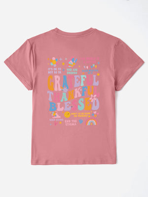 Dusty Pink t-shirt with colorful graphic text and affirmations on the back.