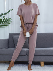 Lilac relaxed-fit tee and jogger lounge set with drawstring waist and cuffed ankles.
