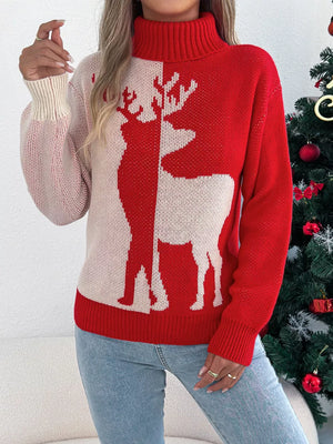 Red and cream colorblock knit sweater with reindeer graphic and turtleneck.