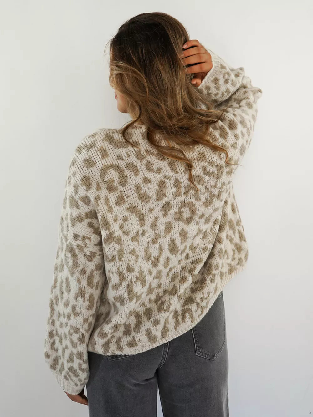 Khaki leopard print knit cardigan with long sleeves, shown from the back.