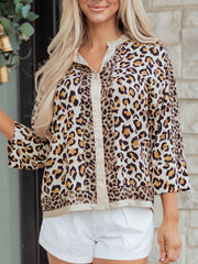 Leopard print button-down shirt with cream collar and cuffs, 3/4 sleeves