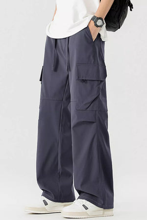 Men's dark gray multi-pocket cargo pants with drawstring waist and relaxed fit.