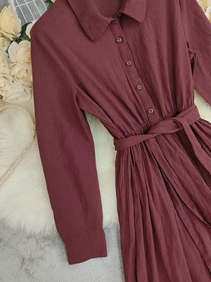 Red belted maxi dress with button front and ruffled hem detail
