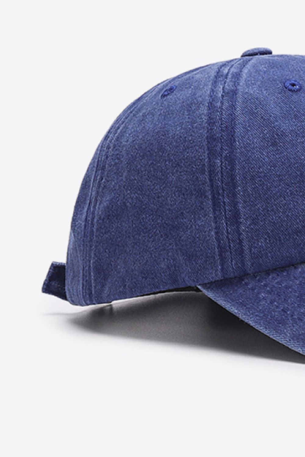 Washed cotton baseball cap in Indigo with adjustable strap detail.