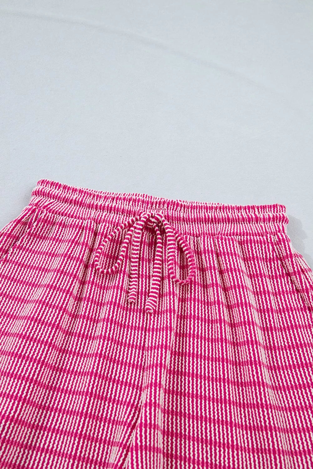 Fuchsia pink striped bikini shorts with drawstring waist