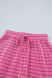 Fuchsia pink striped bikini shorts with drawstring waist