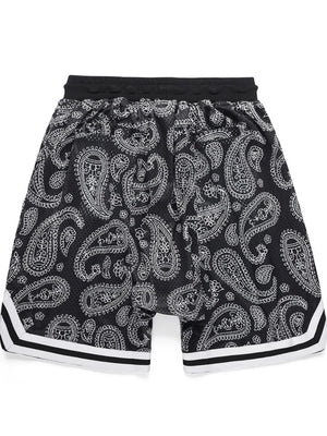 Paisley mesh basketball shorts in black with white accents and striped trim.