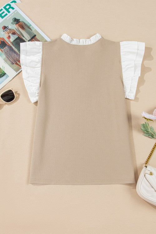 Khaki blouse with white contrast ruffle collar and ruffle sleeves.