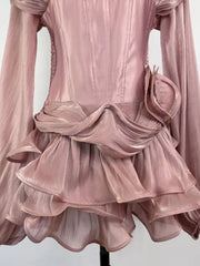 Pink ruffled mini dress with corset waist and draped detail